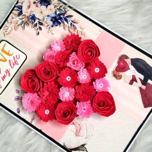 Quilled red flowers in heart greeting card Quilled red flowers in heart greeting card