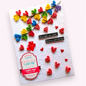 Quilled colorful hearts falling Greeting card