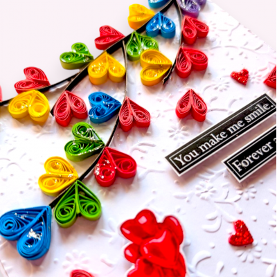 Quilled colorful hearts falling Greeting card
